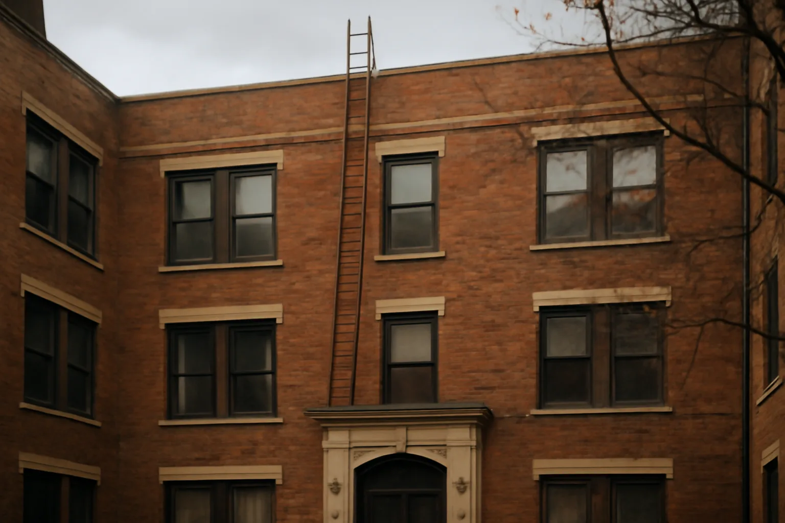 Chicago condo building facade with visible brick and ladder for a reserve study inspection